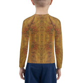 Child wearing CB6-28 rash guard enjoying beach play
